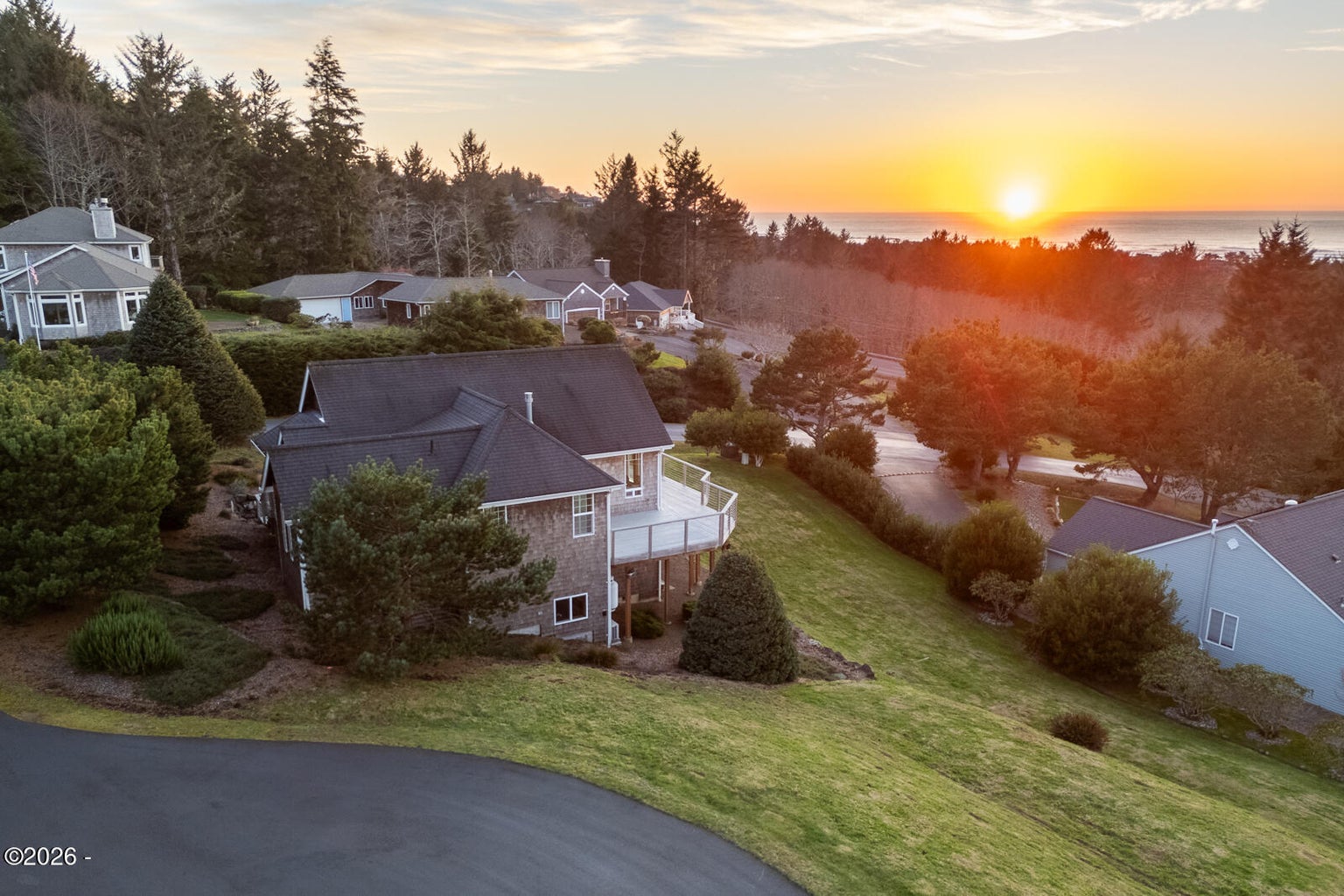 Coastal home at sunset sold at Pacific Overlook, Oregon